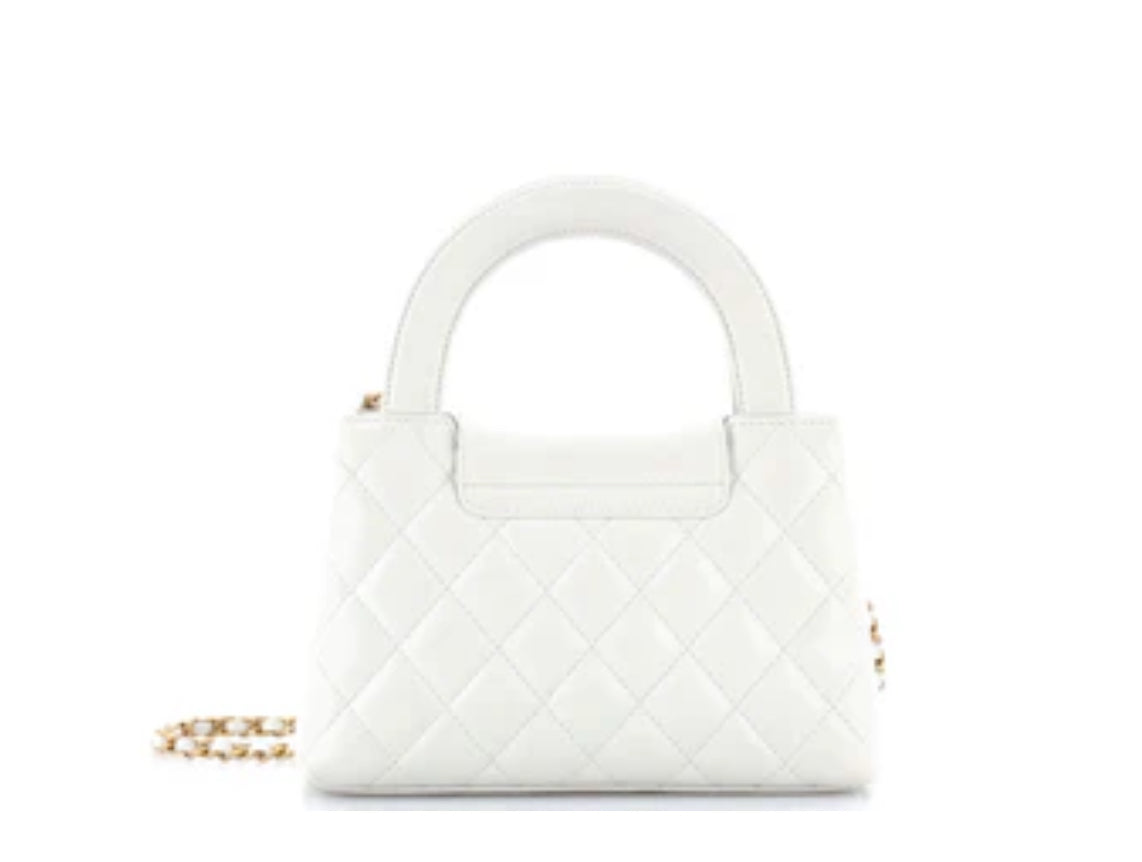 Chanel
Kelly Top Handle Shopping Bag Quilted Shiny Aged Calfskin Mini