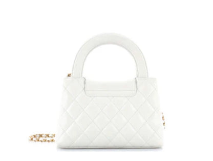 Chanel
Kelly Top Handle Shopping Bag Quilted Shiny Aged Calfskin Mini