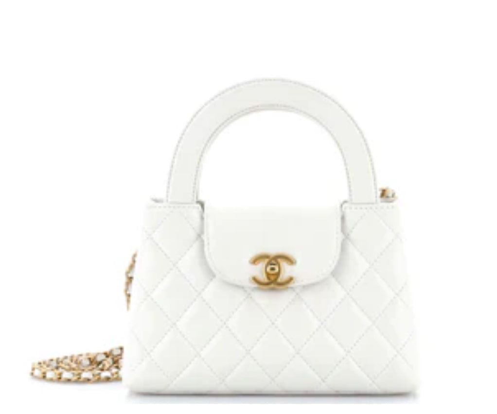 Chanel
Kelly Top Handle Shopping Bag Quilted Shiny Aged Calfskin Mini