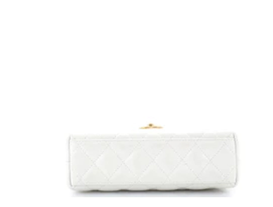 Chanel
Kelly Top Handle Shopping Bag Quilted Shiny Aged Calfskin Mini